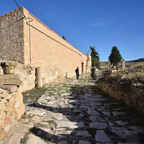 Stone ruins at ancient Madauros in eastern Algeria, with surviving walls and architectural remains under an open sky.