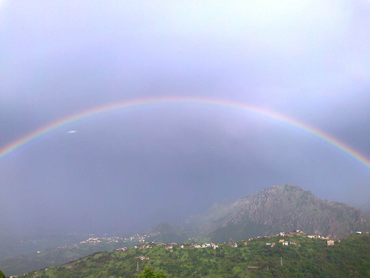 Rainbow over Tala n’Tazert in Kabylie, Algeria