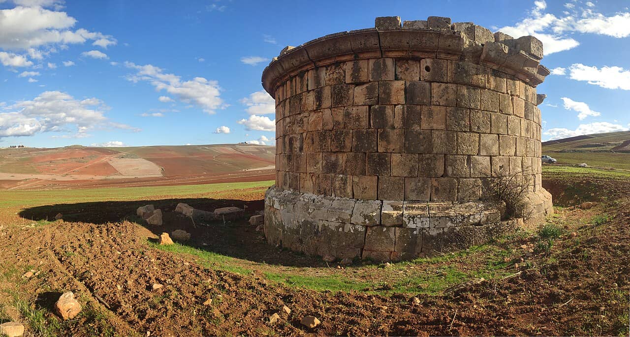 Cylindrical Roman stone monument commemorating the family of Quintus Lollius Urbicus, near Tiddis in north-eastern Algeria.